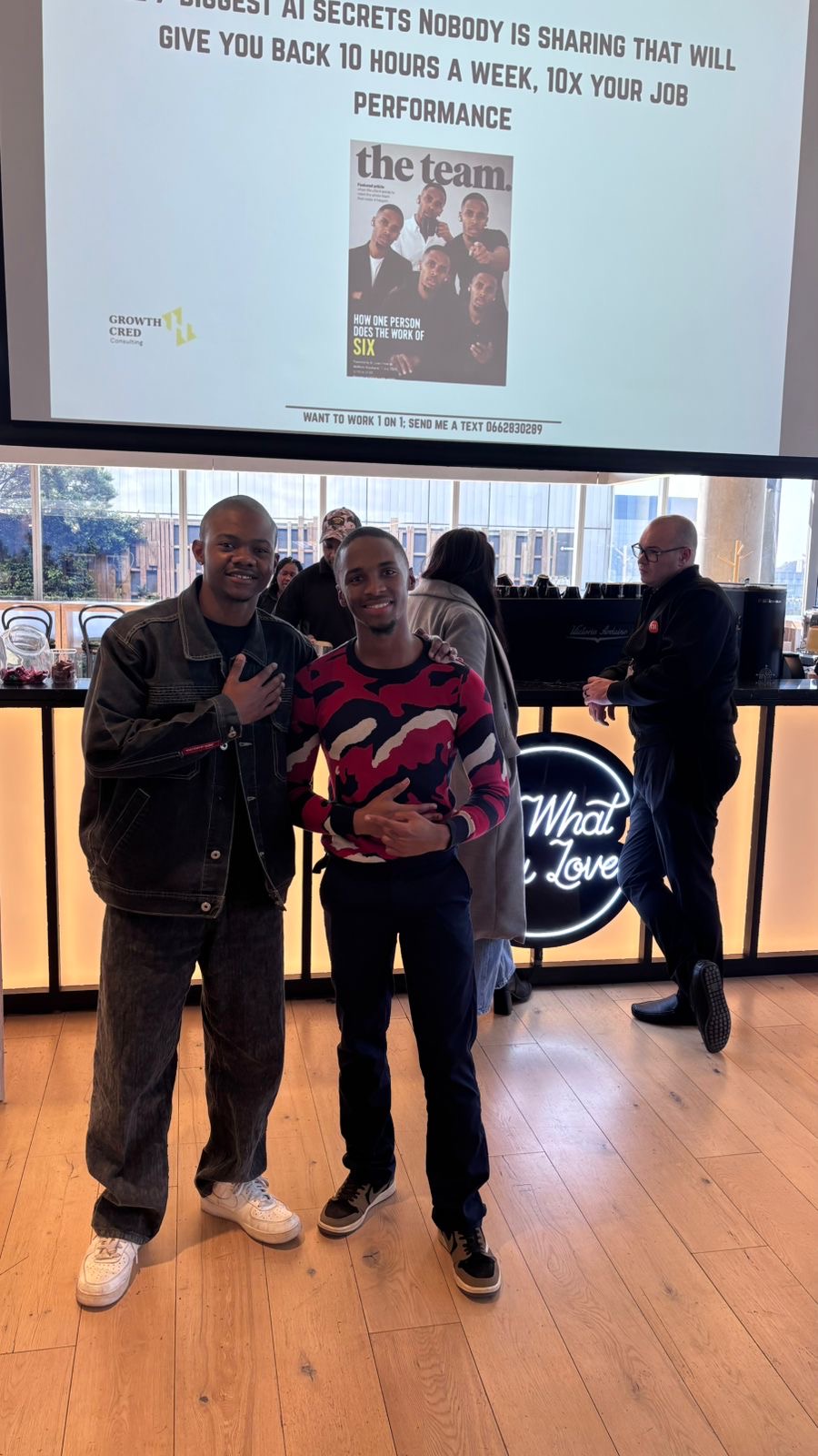 Phila Ngwenya after an AI talk at WeWork Johannesburg, with the talk's slide on the screen behind