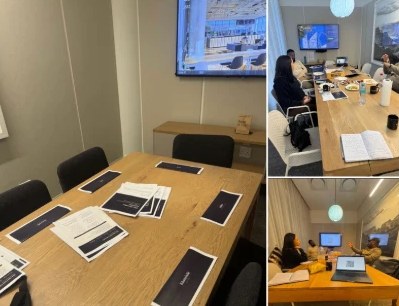 The Operator Intensive room at WeWork Rosebank, set up with workbooks, and owners at work